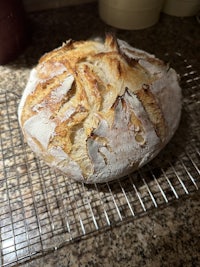 a loaf of bread on a cooling rack